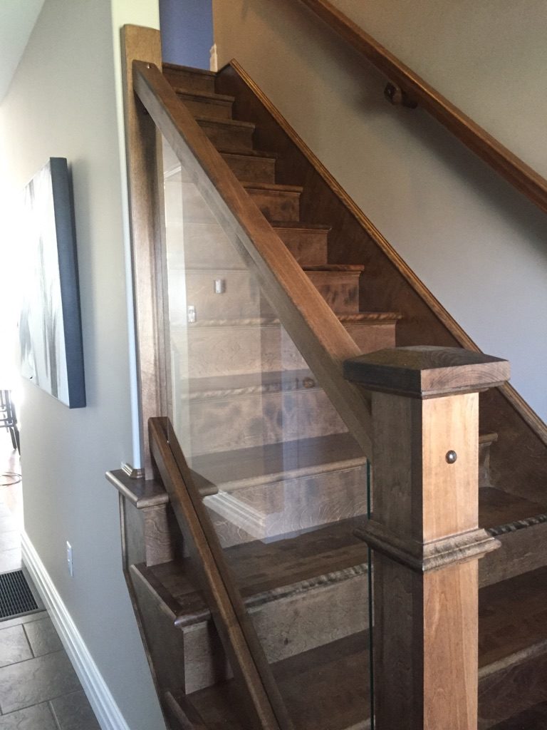 birch hardwood stairs and railings along with glass panel (Stair Parts Canada)